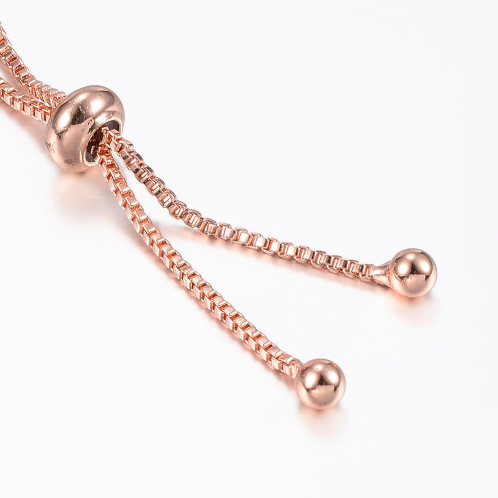 Bracelet double cœur entrelacé – plaqué or rose & zircons