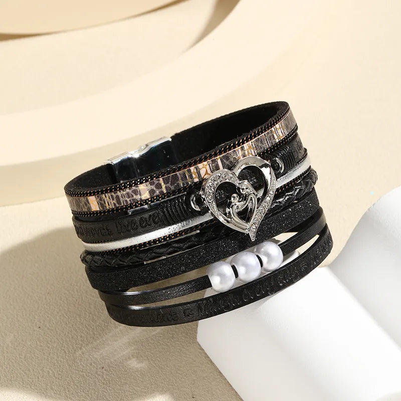 Bracelet multi-rangs cuir noir et cœur argenté