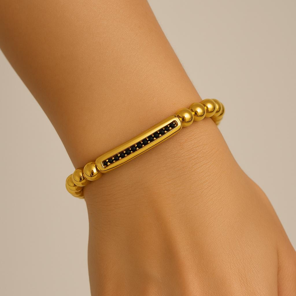 Bracelet perles dorées et pierres noires