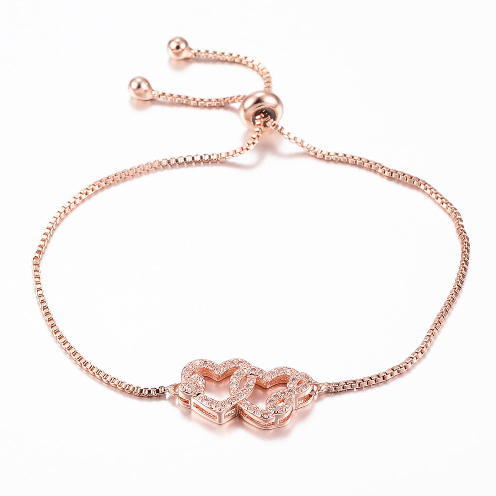 Bracelet double cœur entrelacé – plaqué or rose & zircons
